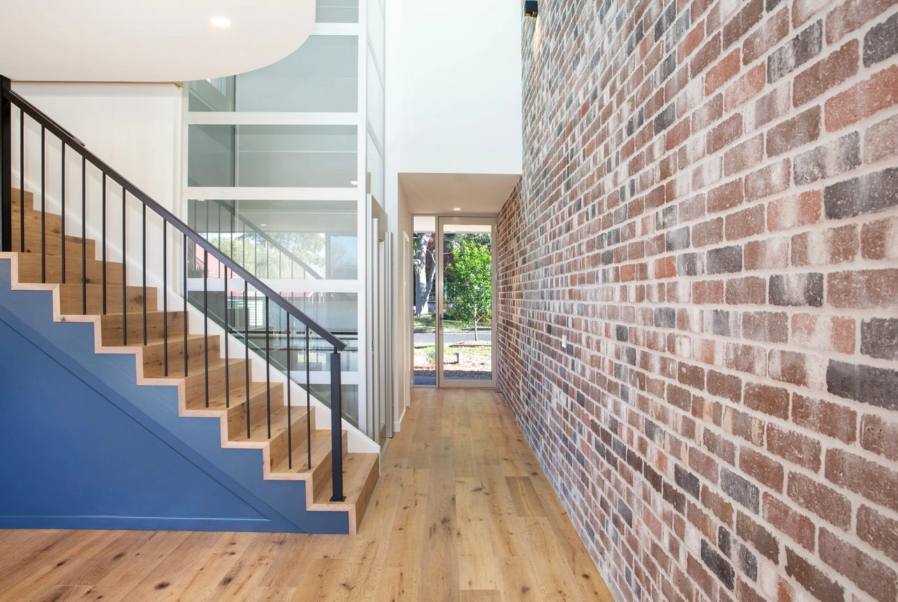 Glass home lift shaft in the entry hallway of a Berry townhouse